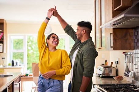 couple dancing in living room