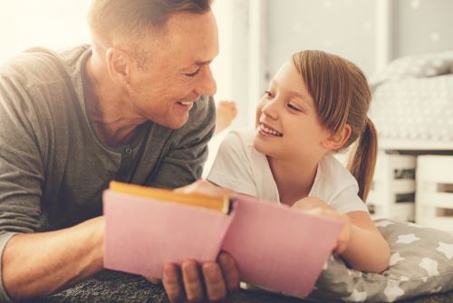 father and daughter reading to symbolize custody in Florida